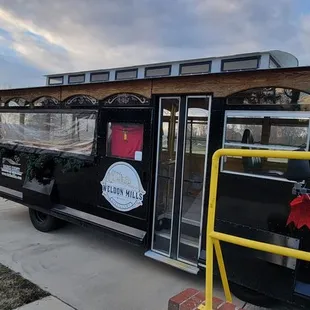 a black trolley with christmas decorations