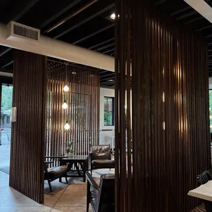 a dining area with a table and chairs