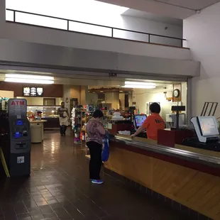a woman standing at the counter