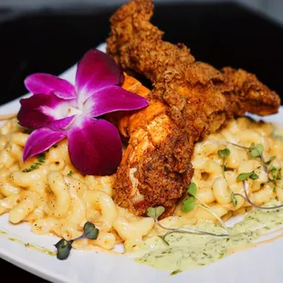 a plate of food with macaroni and cheese