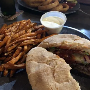 Cheeseburger, sweet potato fries, onion rings and Philly sandwich