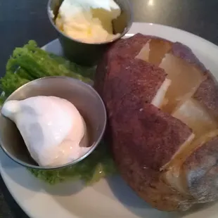 Baked potato, butter and sour cream.