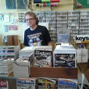 Owner Tom surrounded by his wares.