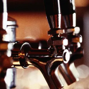 a row of beer taps