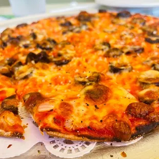 a pizza with cheese and mushrooms