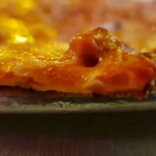 The pan is thicker than the pizza