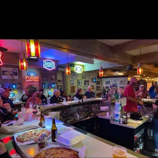 customers sitting at the bar