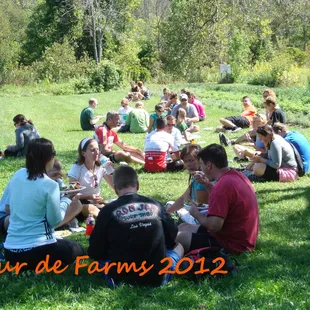 Bike riders eating lunch at Wellspring on the annual Braise tour de farm!