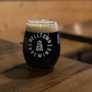 a glass of beer on a table