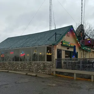 View of the place and patio from the entry parking lot.Trailer Park further to the right.