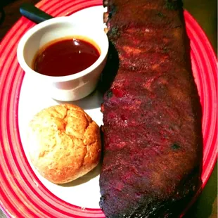 Ribs rubbed w house spices w house sauce on the side.