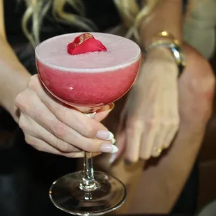 The rose petal topped with gold dust was a glamourous touch to this lovely pink cocktail.