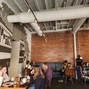 a group of people eating in a restaurant