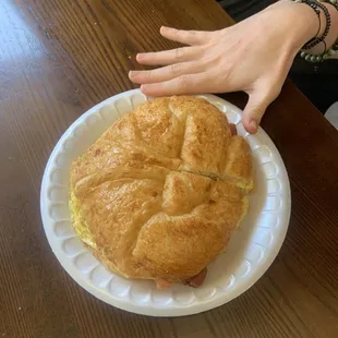Huge eggs cheese and bacon croissant made fresh