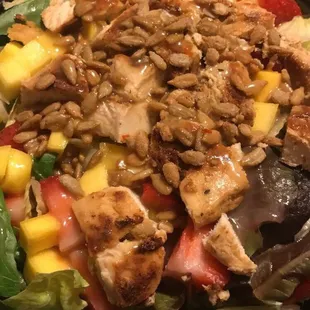 a salad with chicken and fruit
