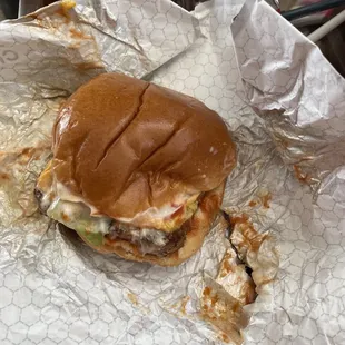 a hamburger with a bite taken out of it