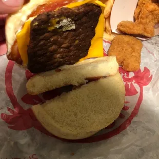 a hamburger with cheese and bacon