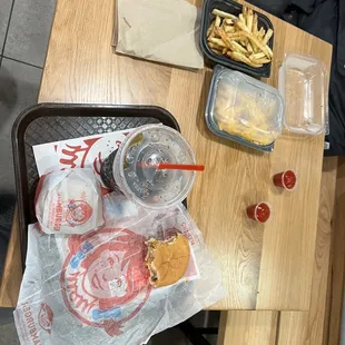 a tray of fries and a tray of ketchup