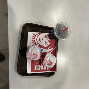 a tray of food and a drink