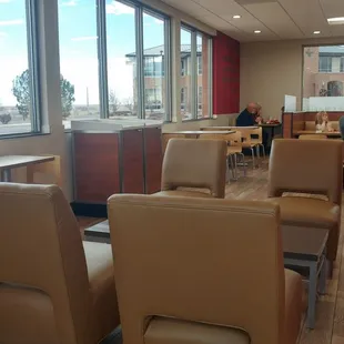 a view of a dining area with chairs and tables