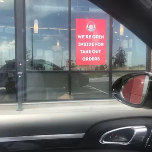a sign in the window of a car