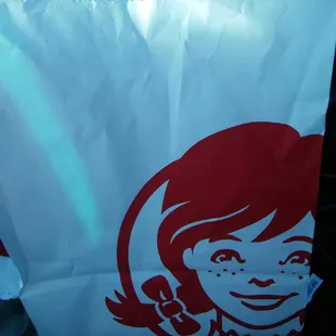 a paper bag with a logo on it