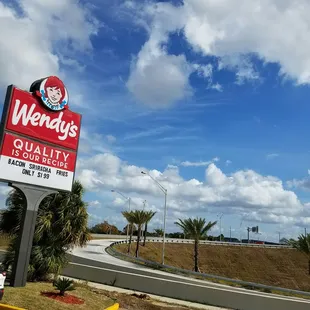 a sign for wendy's quality restaurant