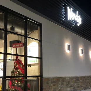 a christmas tree in the window