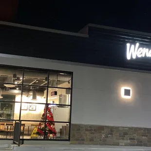 a christmas tree in the window