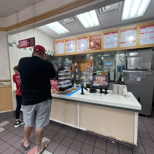 Waited behind this guy inside for over 10 min!! Look at all the trash in the counter, the dirty floors!!!