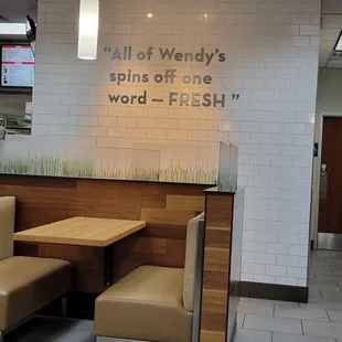 a restaurant with tables and benches