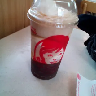 a plastic cup with ice cream in it