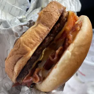 a bacon and cheese sandwich in a wrapper