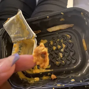 a person holding a waffle in their hand