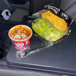 a cup of soup and a sandwich