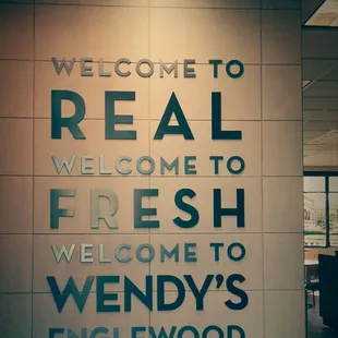 a sign that reads welcome to real, welcome to fresh, welcome to wendy&apos;s englewoodwood