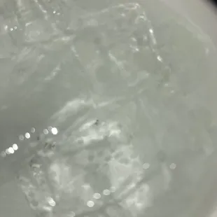 Sprite soda. Inside in the bottom an unknown ingredient. Looks like dirt