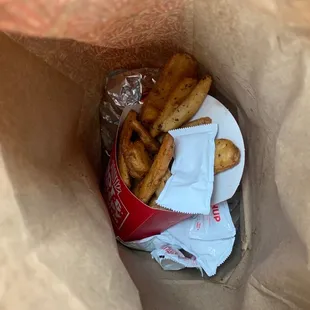 2 breakfast sandwiches and potatoes