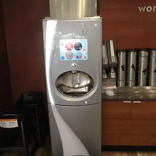 a water dispenser in a coffee shop