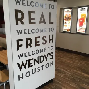 a welcome sign in a restaurant