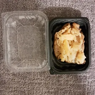 a plastic container with food in it