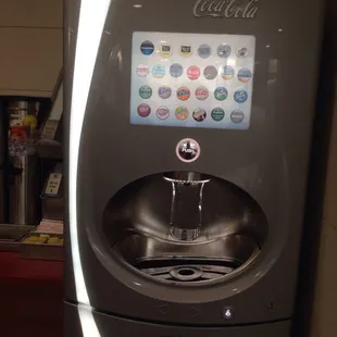 a soda machine with a drink dispenser