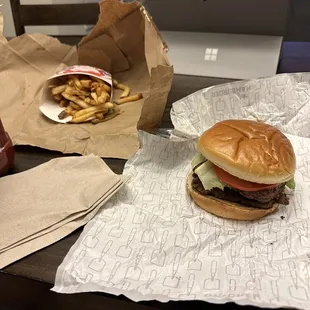 a hamburger and fries on a table