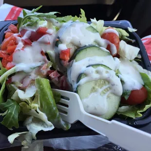 a salad in a plastic container