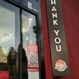 a thank you sign on the front of a restaurant