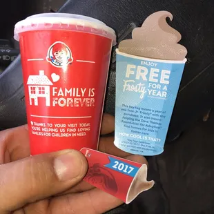 Red cup is the free mini frosty you get when you buy a key chain. A free mini Frosty with any purchase.