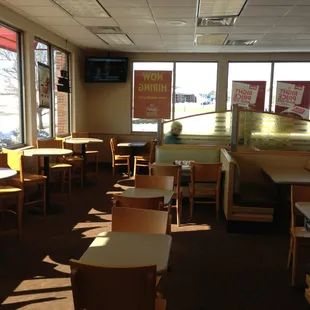 Seating area with TVs on both sides.