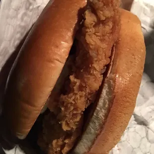 a fried chicken sandwich in a wrapper