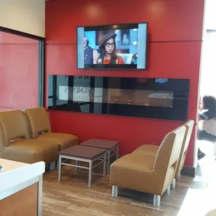 a tv in the corner of a waiting room