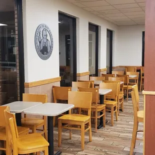 empty tables and chairs in a restaurant